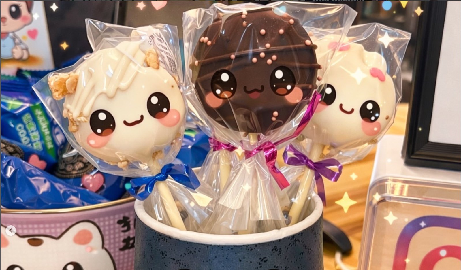 Three handmade kake pops with kawaii faces